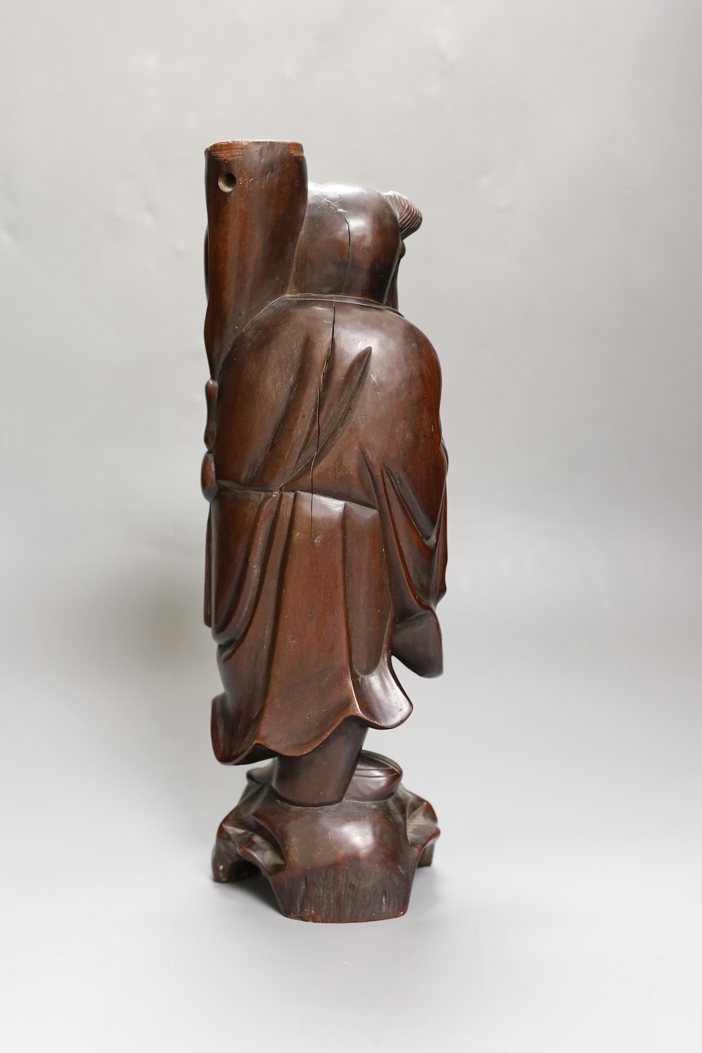 A Chinese hardwood figure of an immortal, 36cm